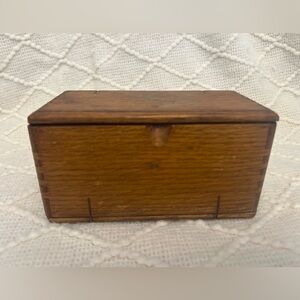 Antique 1889 puzzle box for sewing accessories/attachments.